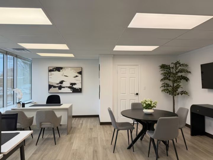 Furnished office with desk and seating