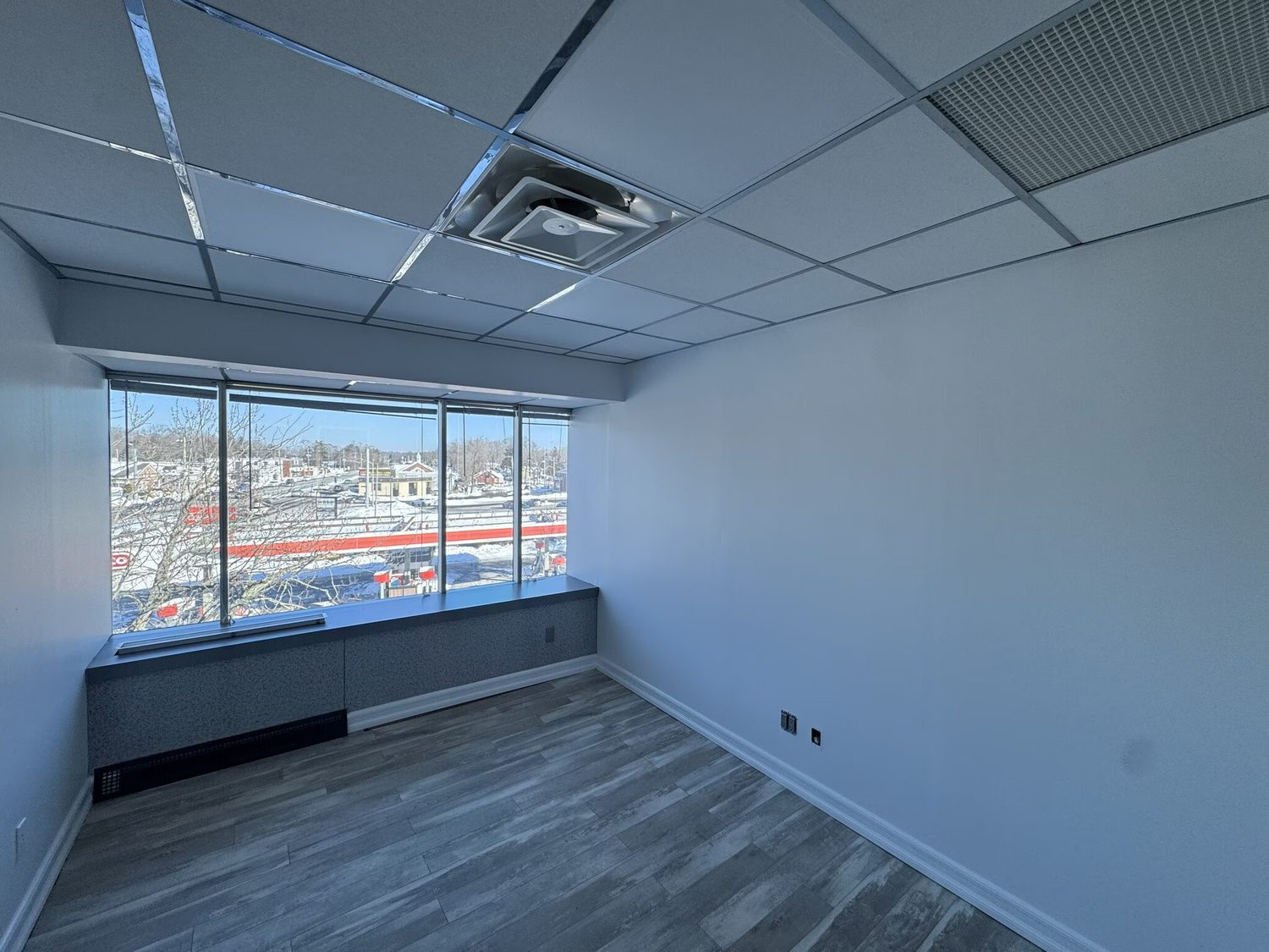 Office suite with corner windows and Route 110 view